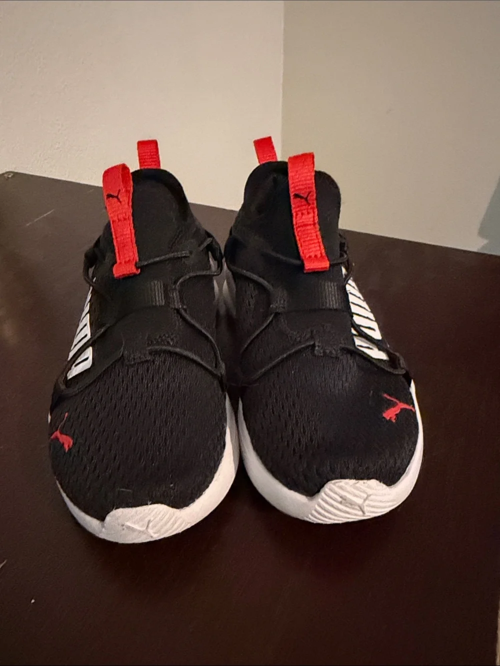 Puma Kids Black Sneakers with Red Accents and White Sole